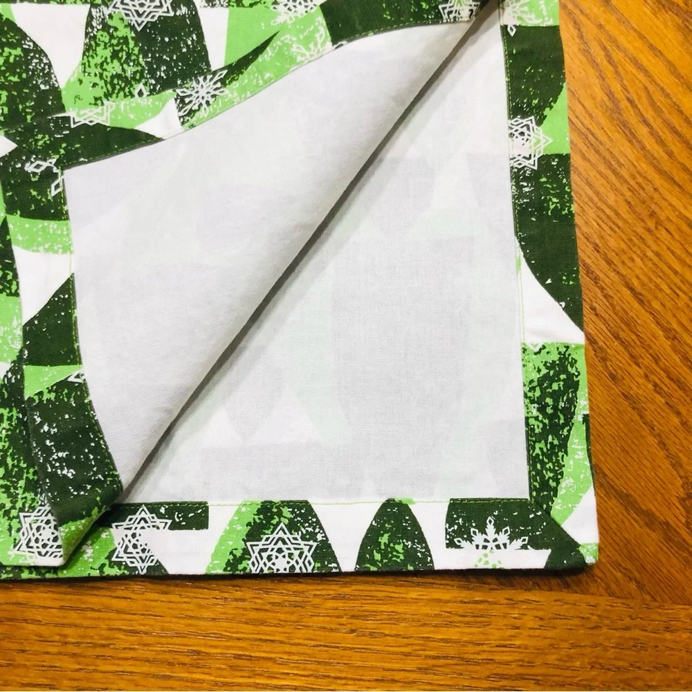 Crate & Barrel Snowy Forest, Shades of green on white Table Runner, 24”x90”.